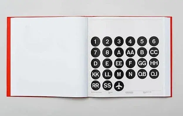 Page of black circles with white numbers or letters indicating the train.